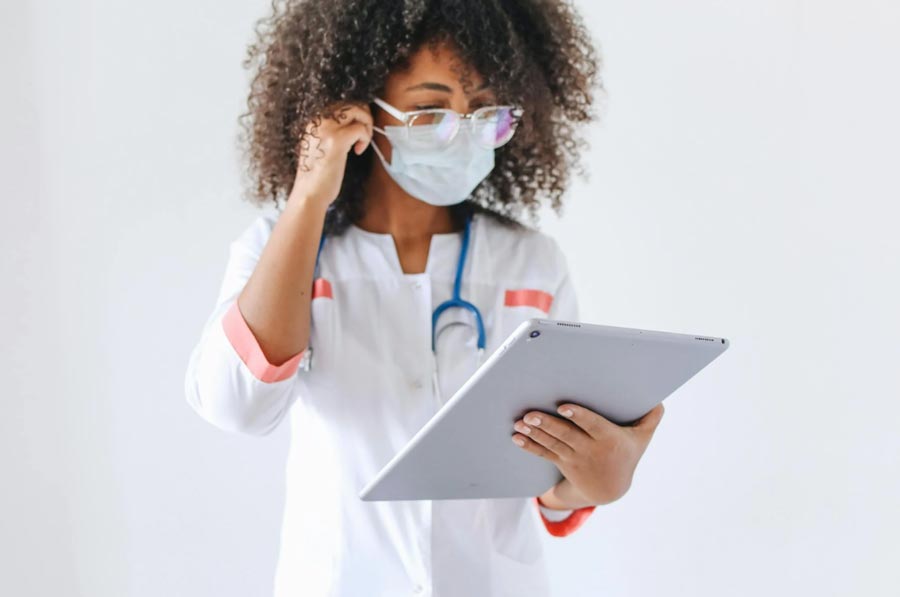 Doctor Using a Tablet