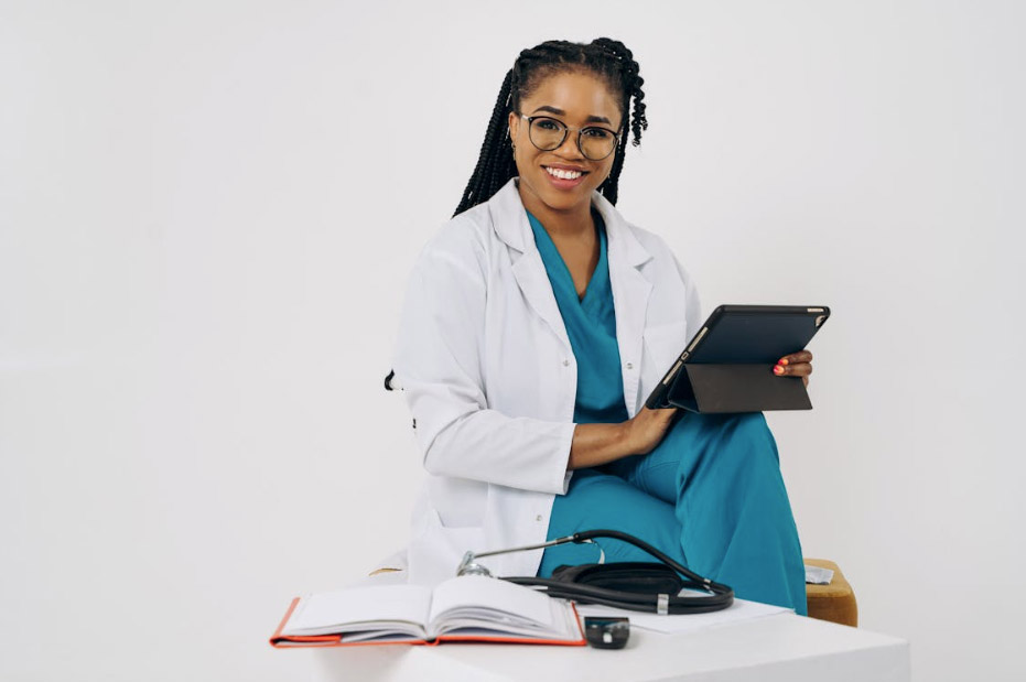 Doctor Sitting with Tablet
