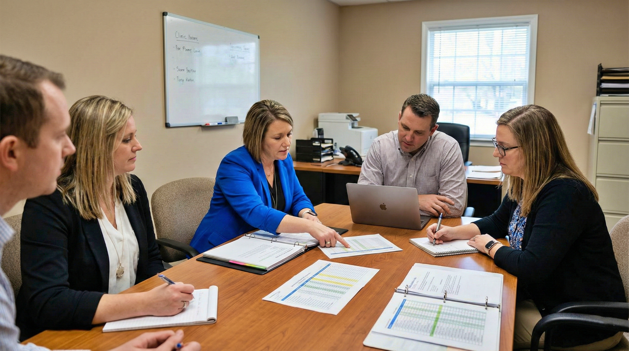 Patient 360 | What Are the Costs and Benefits of Upgrading Your EHR for MVP Preparation? medical administrators planning meeting