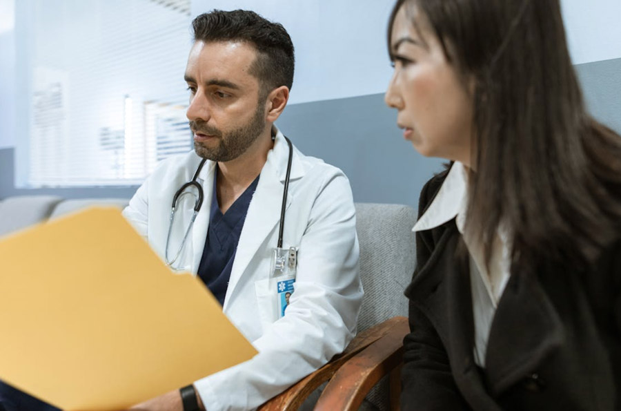 Patient 360 | What Is the Ambulatory Specialty Model (ASM) and Who Should Participate? Male Doctor talking to a Patient