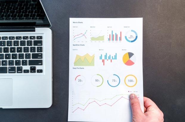 Patient 360 | How Does the Ambulatory Specialty Model Differ From Traditional MIPS Reporting? Person Holding Chart And Bar Graph